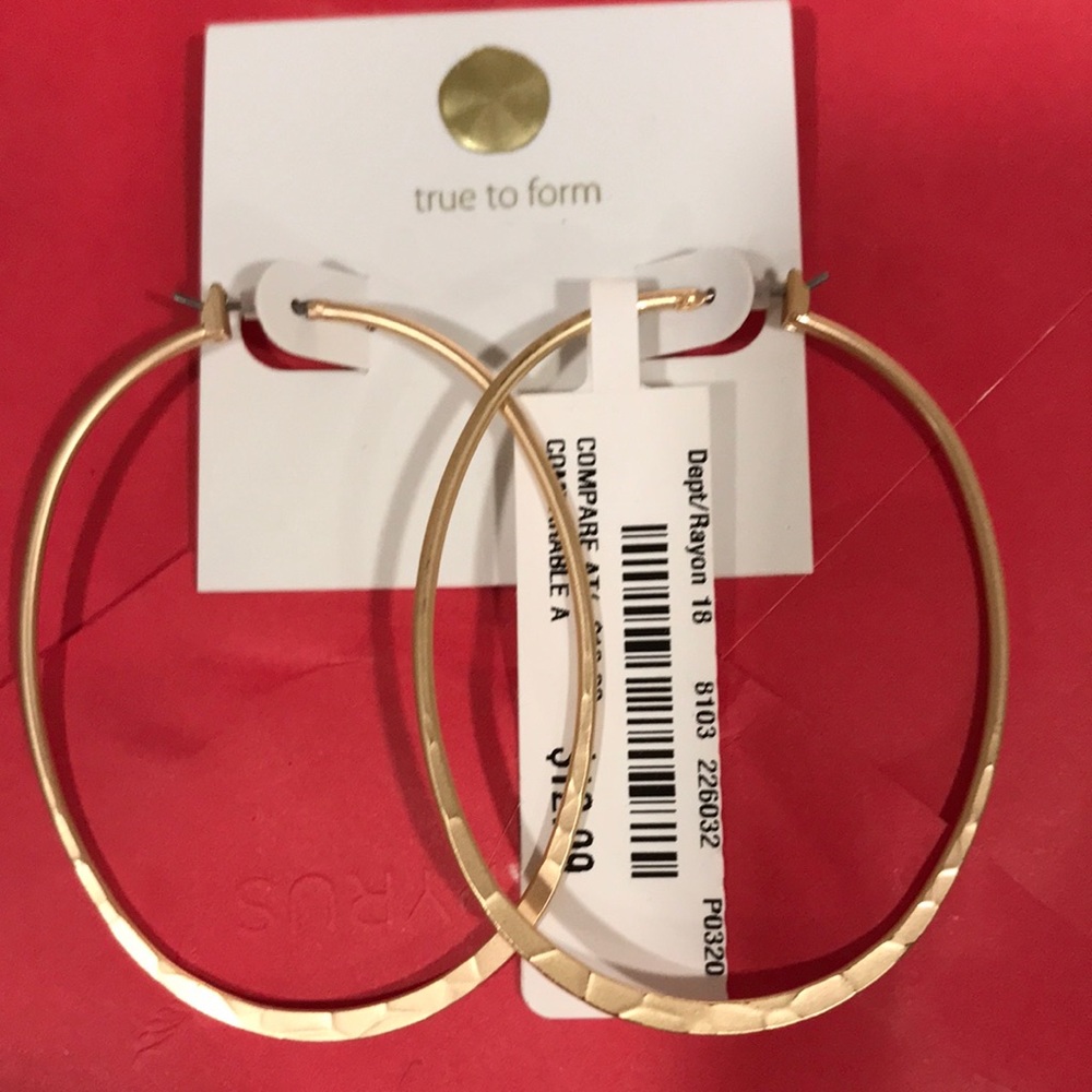 Wavy pattern hammered onto oval earrings